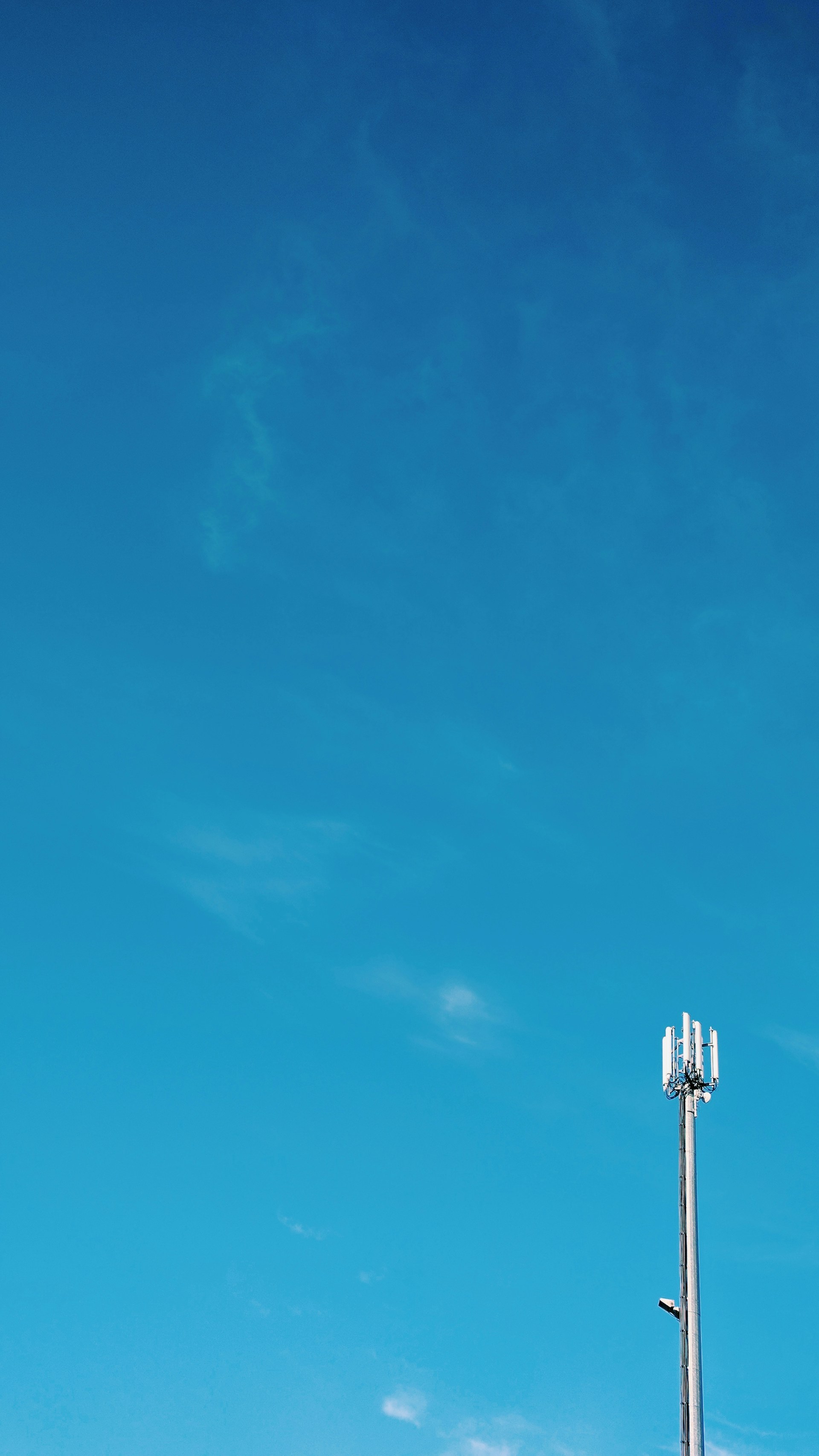 woman wearing yellow long-sleeved dress under white clouds and blue sky during daytime
