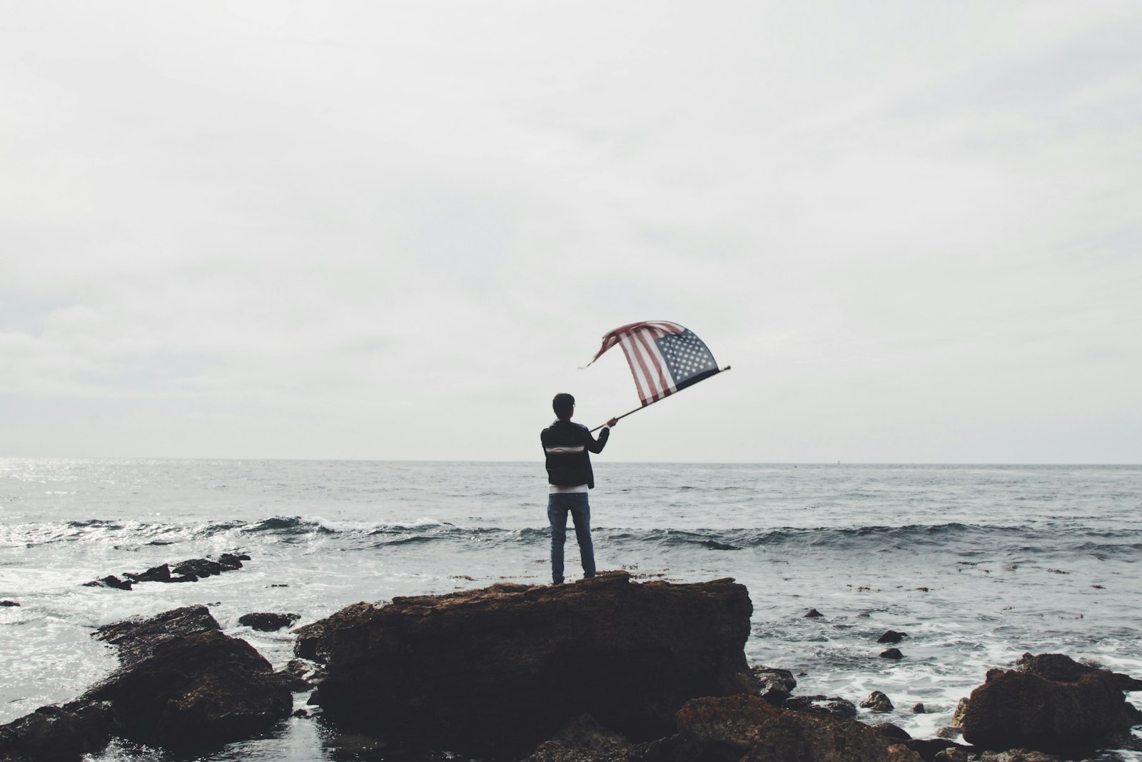 Canon EOS 70D + Canon EF 24-105mm F4L IS USM sample photo. Man holding flag of photography