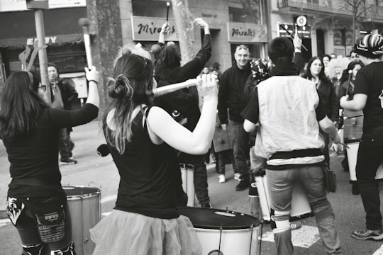 Musicians engaging in a lively drum demonstration during a community event.
