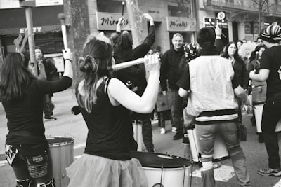A group drum circle session showing students in rhythm at the studio
