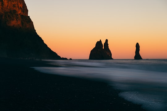silhouette photo of boulders in Reynisdrangar Iceland