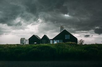 house underneath cumulus clouds