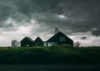 house underneath cumulus clouds