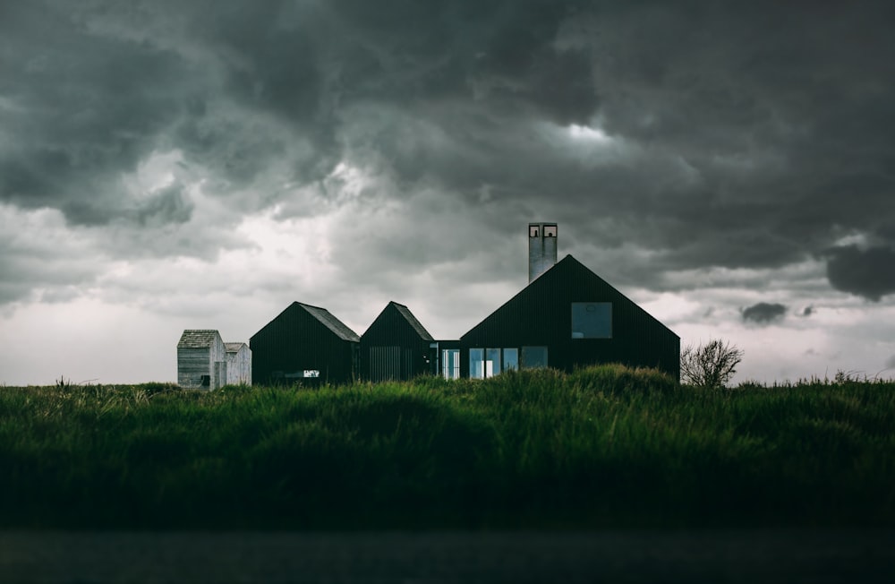 house underneath cumulus clouds