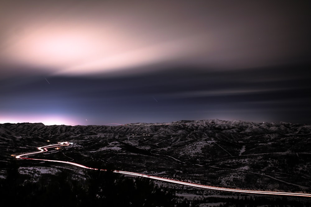 time lapse photography of cars and road