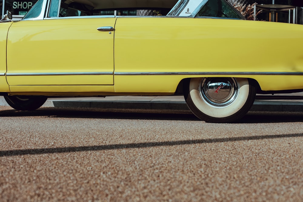 photo of yellow coupe on road