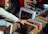 A person using a smartphone app to check vinyl record values.