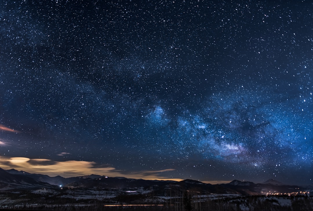 mountains with trees under white star at night, It’s amazing to see the moving city and cars while also seeing the milkyway.<p></figure>It wasn’t as hard to get this shoot as it seems. Like a lot of things it really just needed a lot of patience (2 hours worth).</p><p>Worth it.