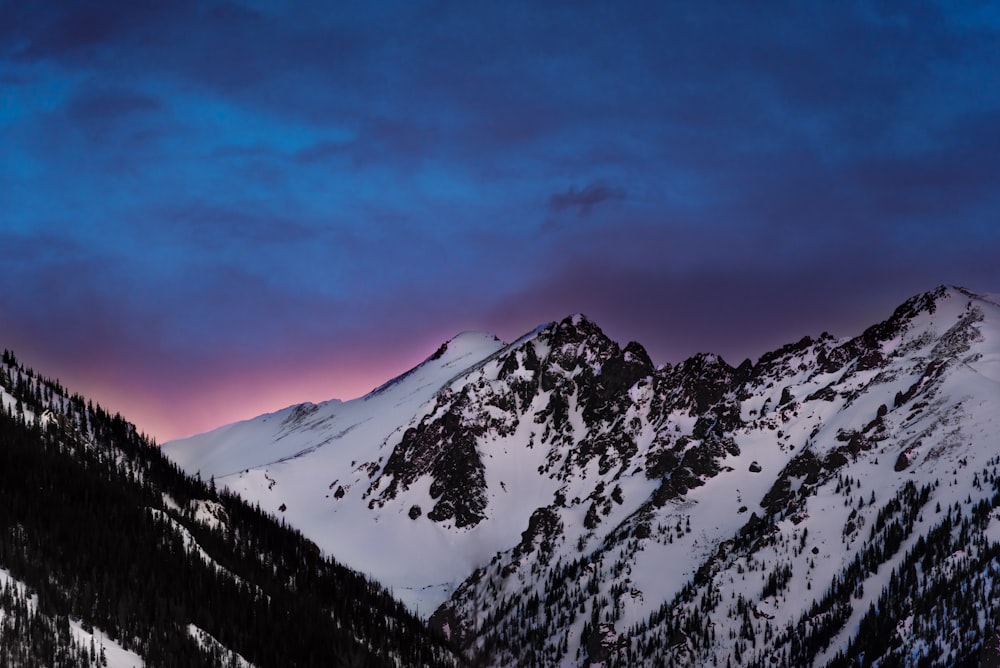 snow covered mountains under blue sky