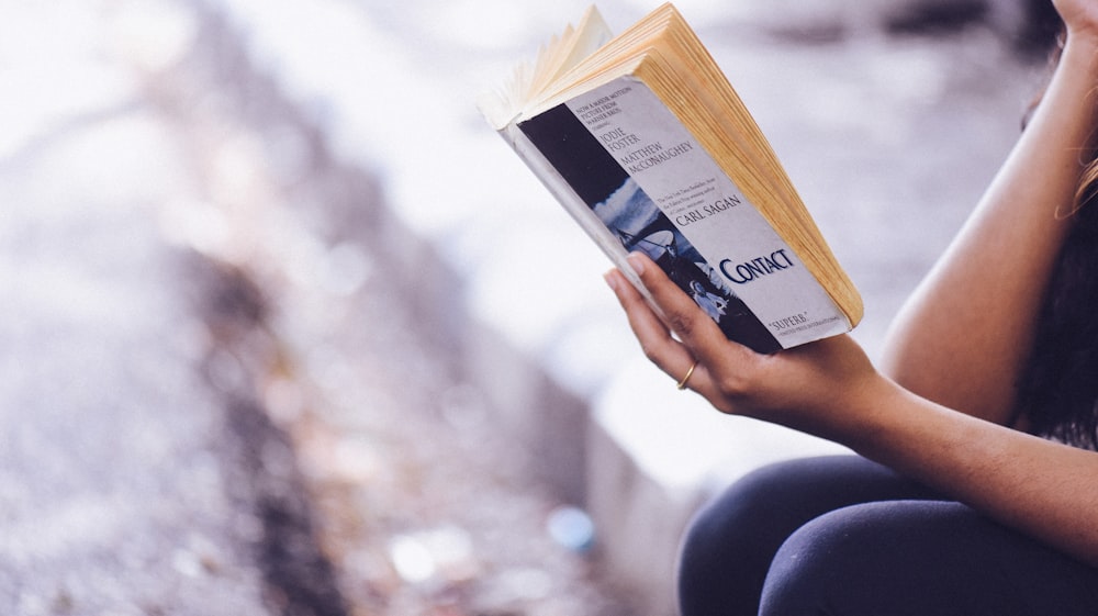 person holding book