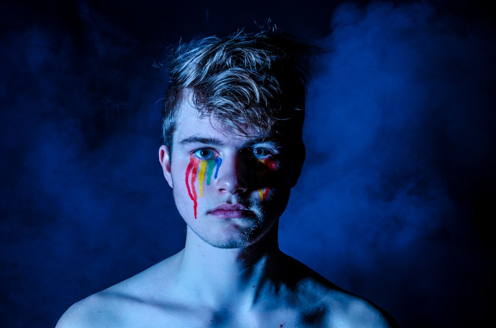 photo of man crying with colored tears