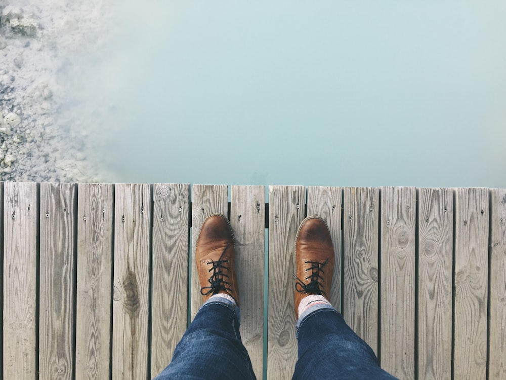person standing on dock