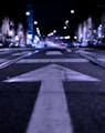 shallow focus photography of road with forward arrow illustration