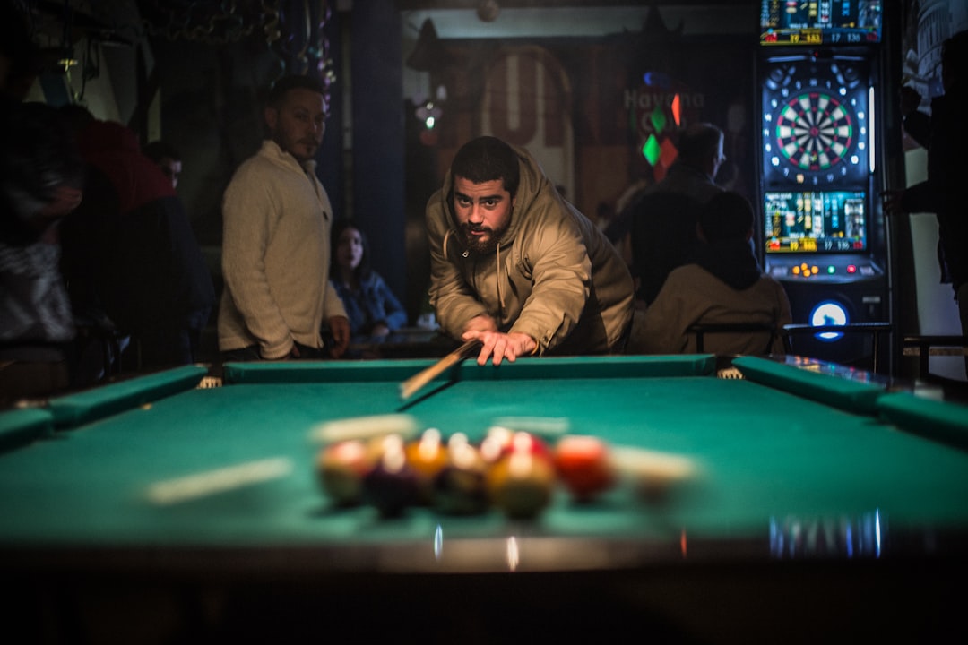 man in brown jacket playing billiard, Break-off shot