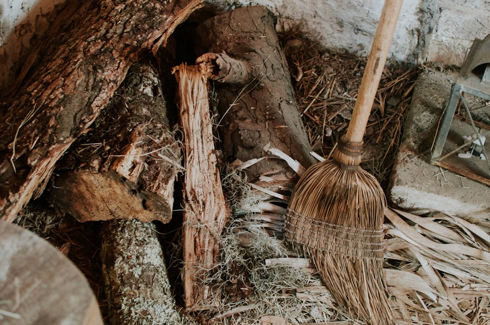 brown broom on brown fire logs