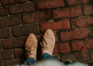 person standing on brick pavement