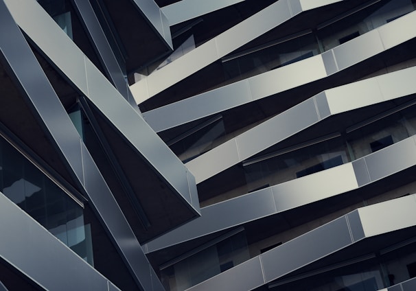 low angle photography of gray building at daytime