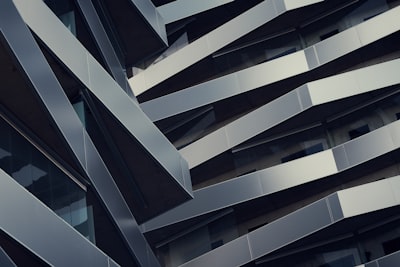 low angle photography of gray building at daytime architecture teams background