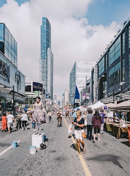 A bustling street filled with festival-goers.