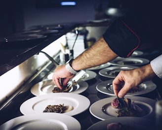 person preparing cooked dish