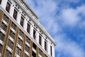 Exterior shot of Vaibhavlakshmi building against a clear blue sky.