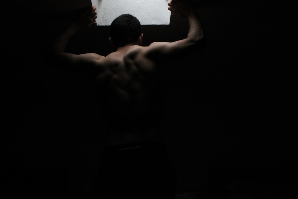 man holding concrete ceiling