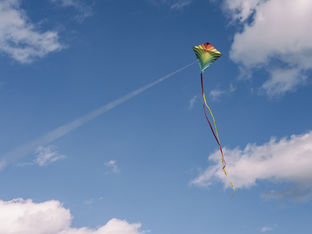 green and yellow kite on air