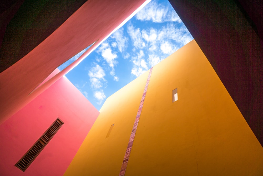 low-angle photo of yellow building