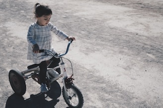 girl riding trike