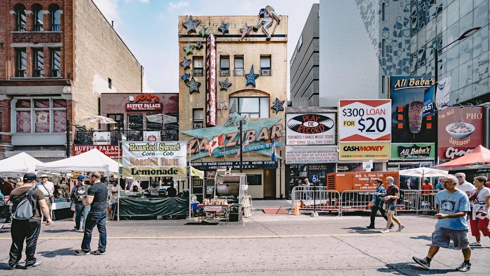 people walking in street near buildings