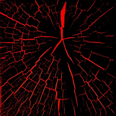 A pattern resembling a cracked surface with red fissures spreading outwards on a black background. The cracks are irregular and create a web-like appearance.