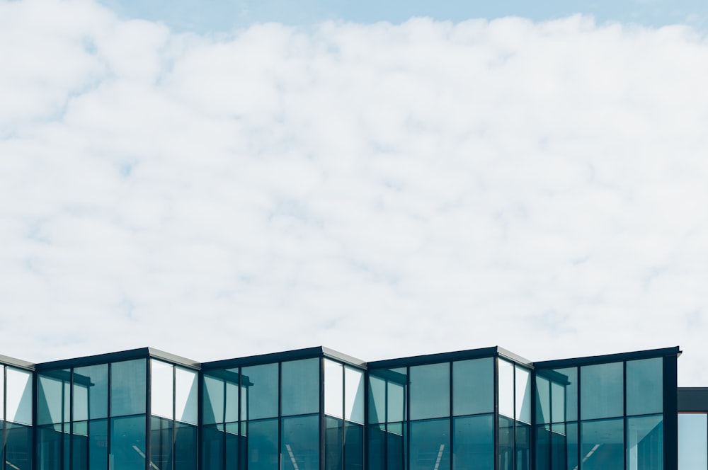 curtain wall building under cloud formation during daytime