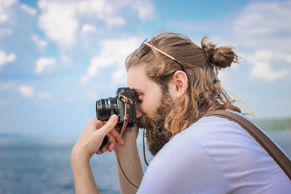 man taking a picture during daytime