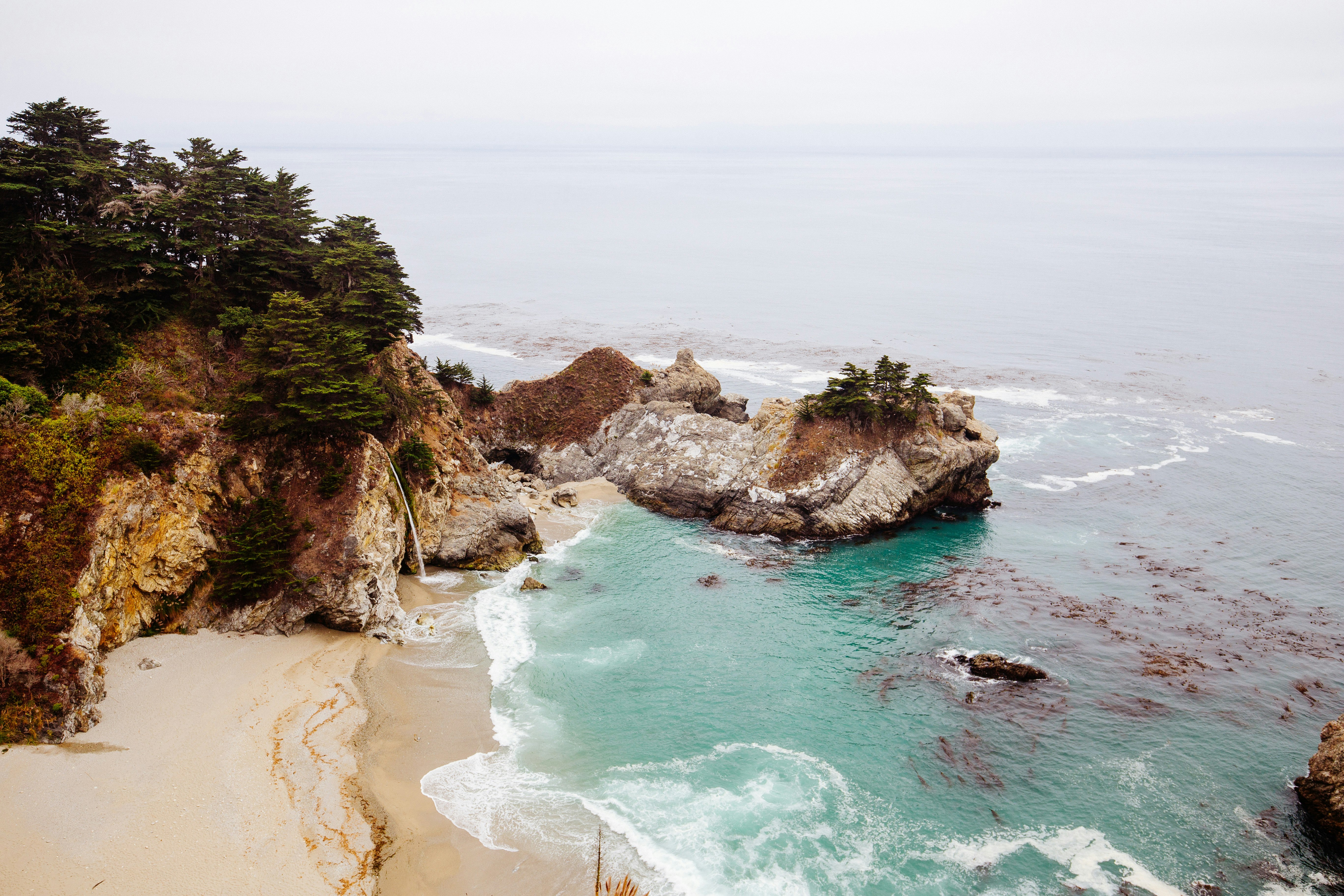 aerial view of cliff near body of water