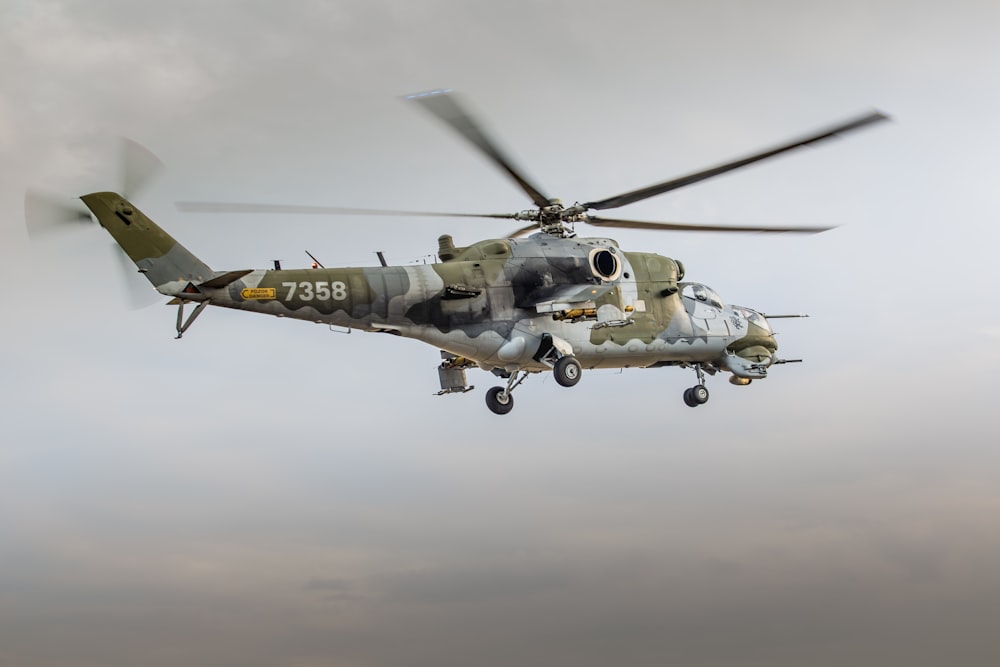 low angle photography of brown and gray helicopter