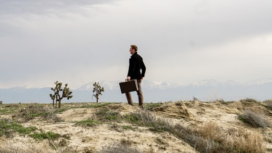 man standing on brown field grass during daytime in Lancaster United States