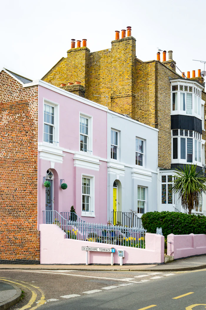 Row of pastel-colored colonial houses, similar to Cockburn Town's historic architecture