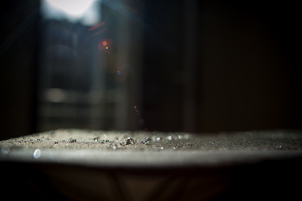 Macro shot of water droplets on a rough surface