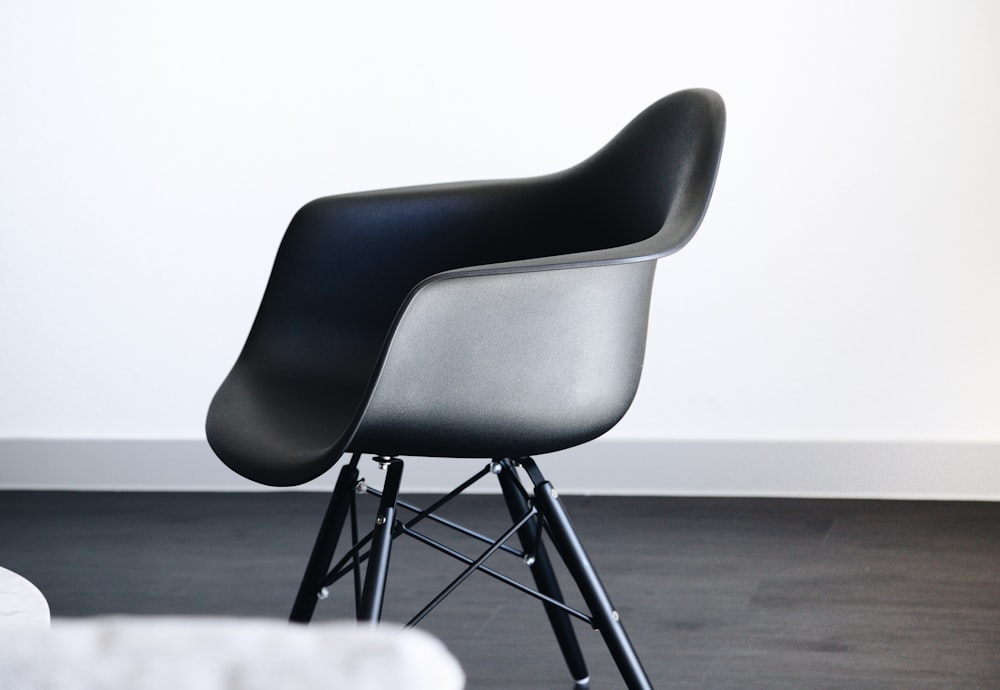 empty black plastic tub chair