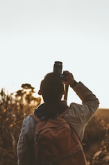 man taking picture using DSLR camera
