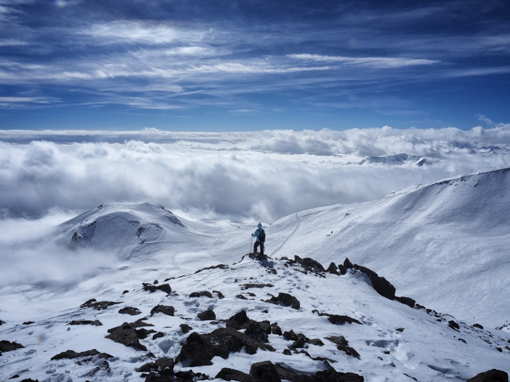 person on snow covered mountain