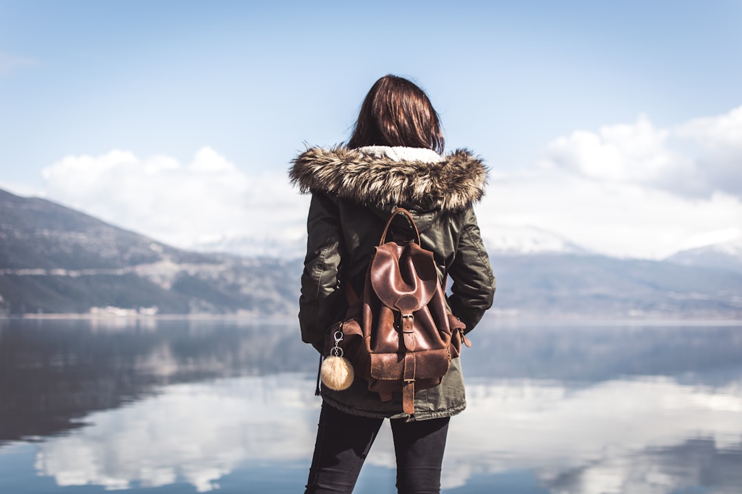 woman facing body of water, Mountain vista in Ioannina