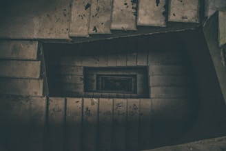 top view photography of grey spiral staircase