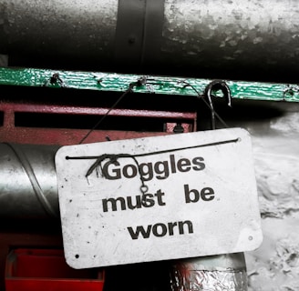 goggle must be worn sign hanging on nail