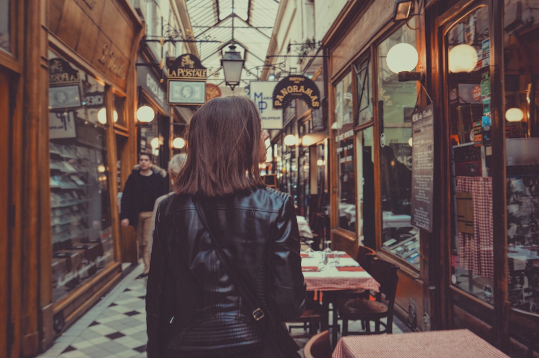 woman walking in hallway, Passage in Paris