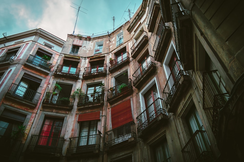 multicolored apartment building in low angle photography