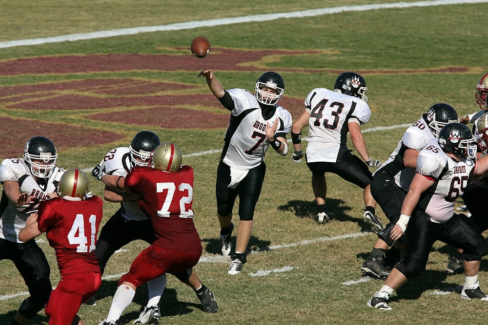 group of men playing football