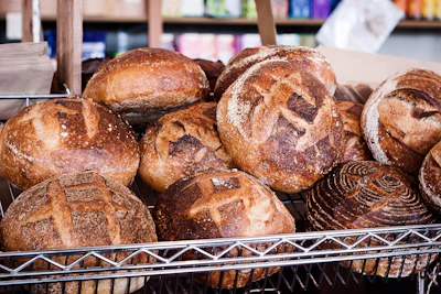 Stacks of freshly baked breads and pastries, highlighting the perfect rise and crust.