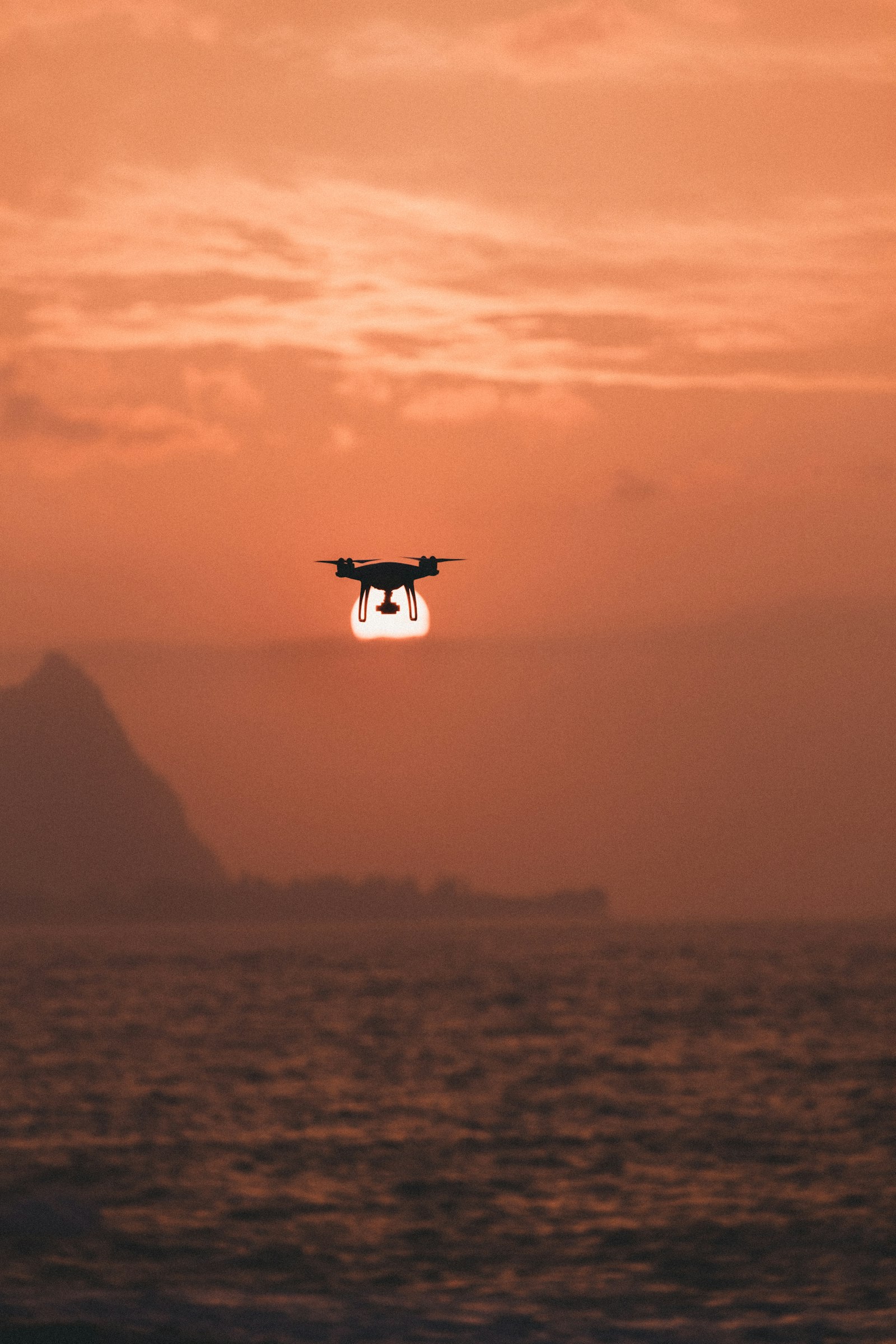 Canon EOS-1D X Mark II + Canon EF 70-200mm F2.8L IS II USM sample photo. Silhouette of drone hovering photography