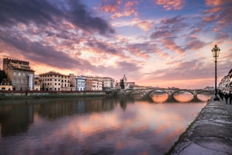 Scenic view of Florence with historic buildings and the Arno River.